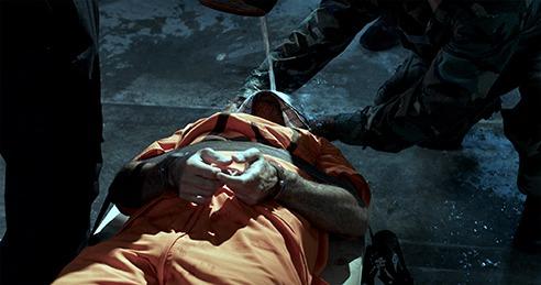 A person lying on the ground
Description automatically generated