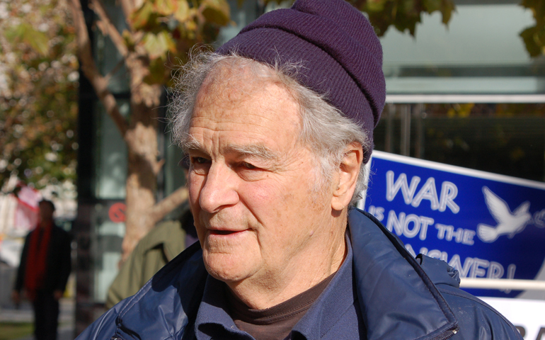 A person wearing a beanie and a hat

Description automatically generated