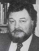 A person with a beard

Description automatically generated