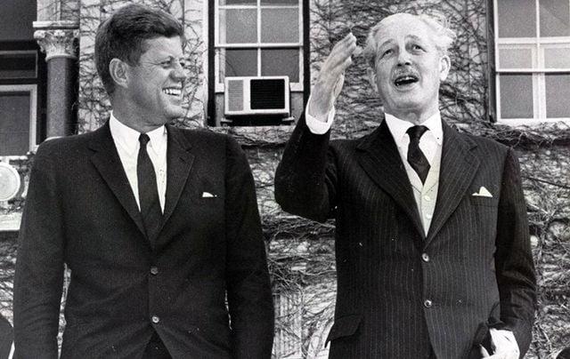 A couple of men in suits

Description automatically generated