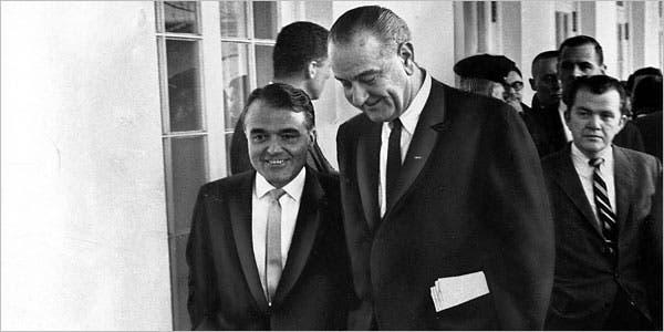A couple of men in suits

Description automatically generated