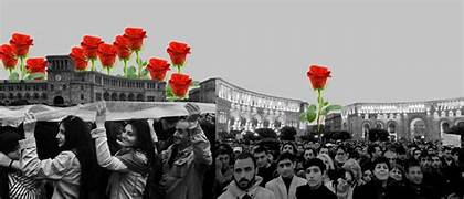 A group of people holding flowers
Description automatically generated