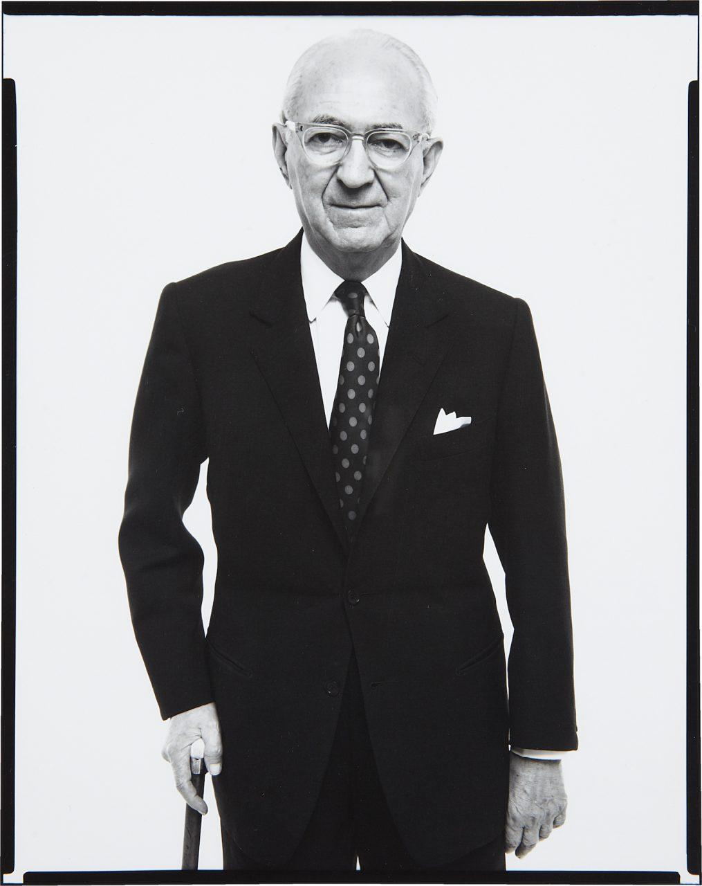 A person in a suit and tie

Description automatically generated