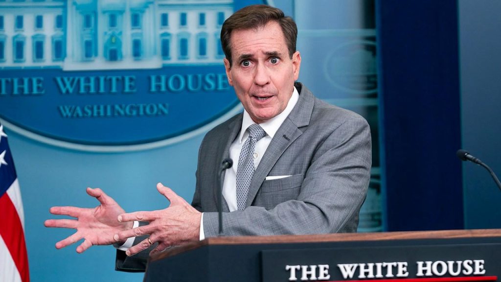 A person in a suit speaking at a podium

Description automatically generated