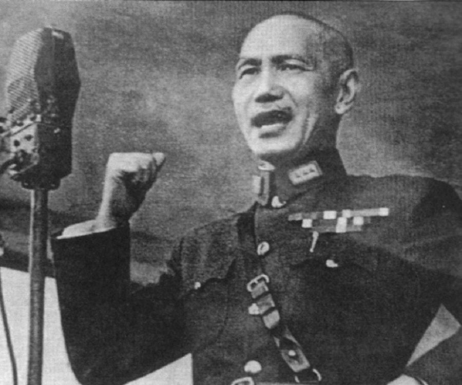 A person in uniform holding up his fist

Description automatically generated