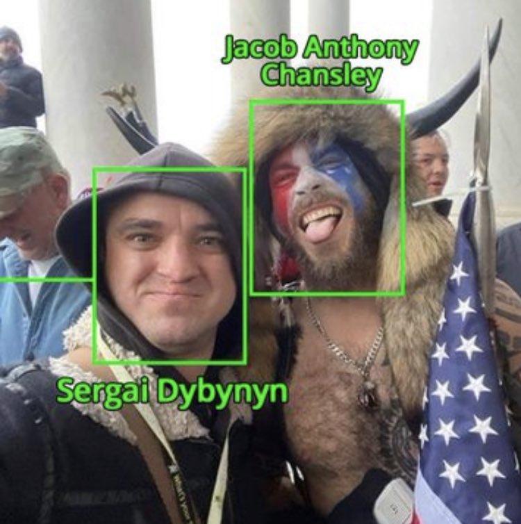 A selfie of two men Description automatically generated
