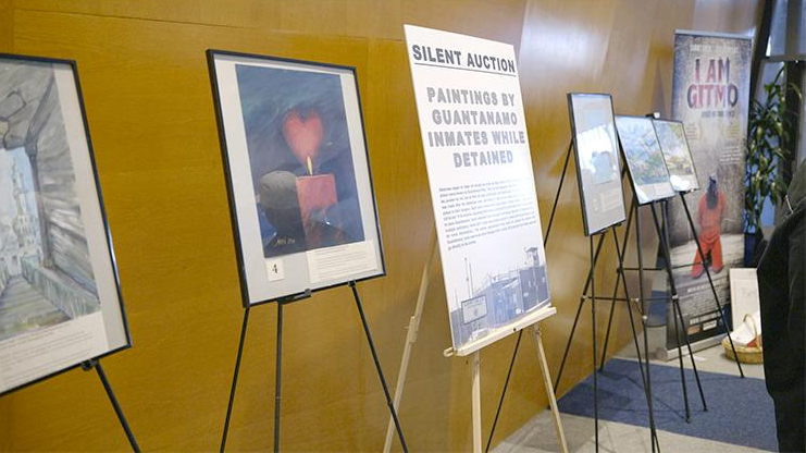 Several easels with paintings on them

Description automatically generated