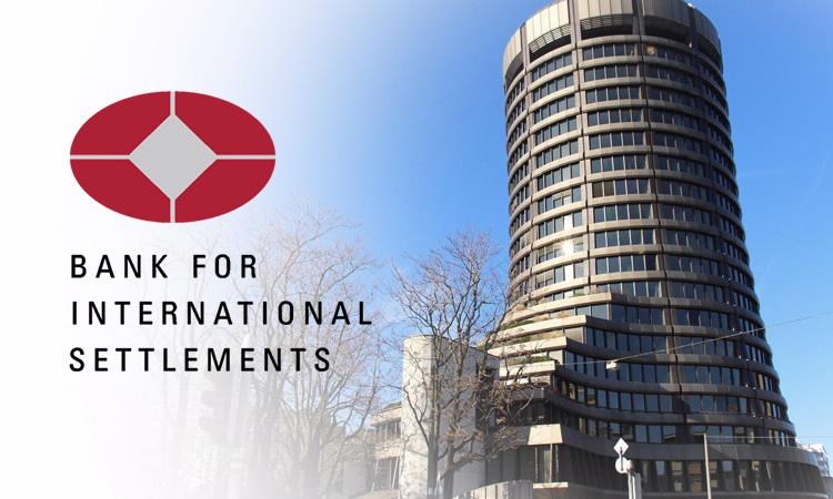 A circular building with a red and white logo

Description automatically generated