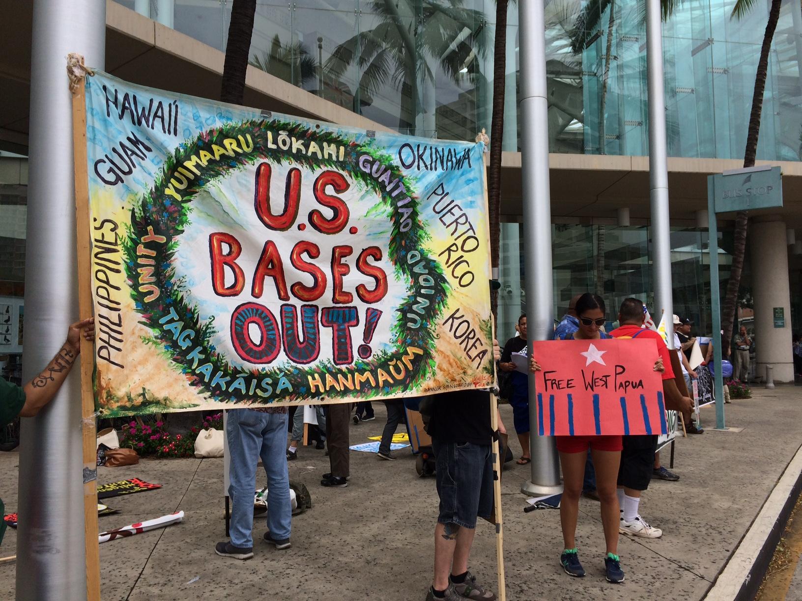 A group of people holding a sign

Description automatically generated