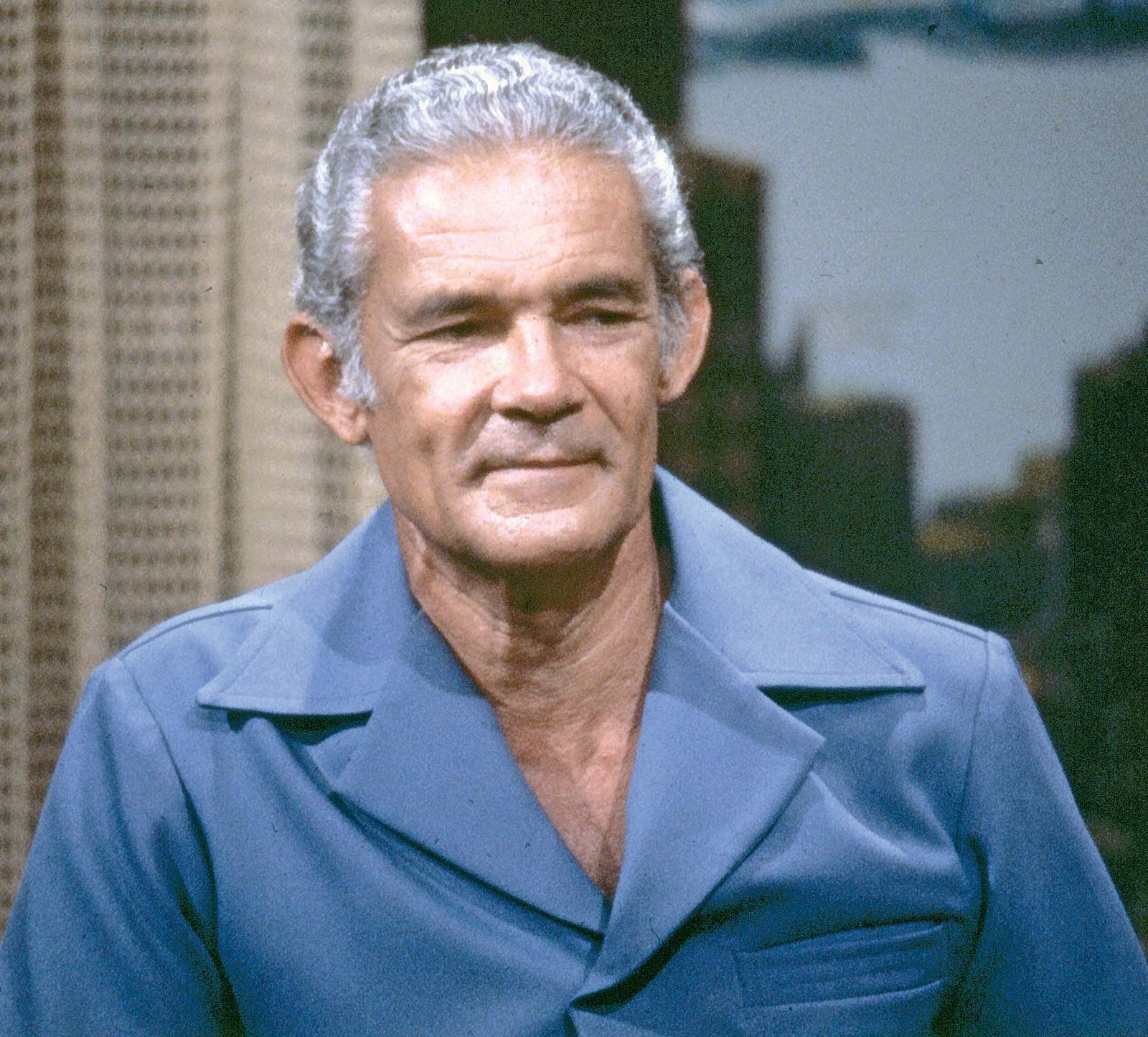 A person in a blue shirt

Description automatically generated