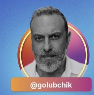 A person with a beard
Description automatically generated