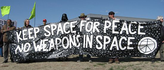 A group of people holding a banner

Description automatically generated