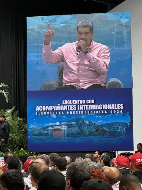 A large screen with a person on it Description automatically generated