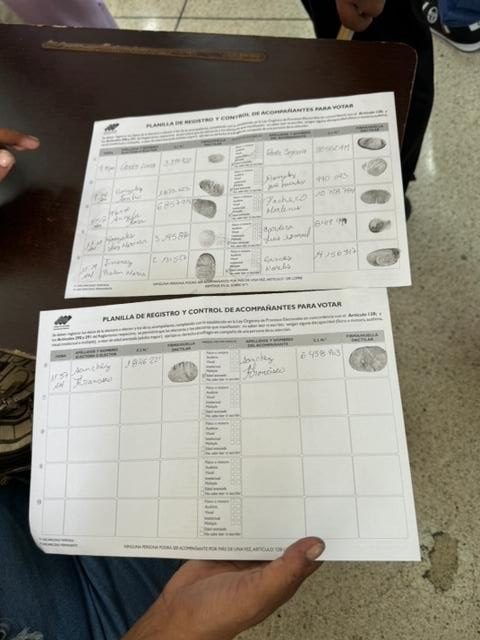 A person holding a document Description automatically generated