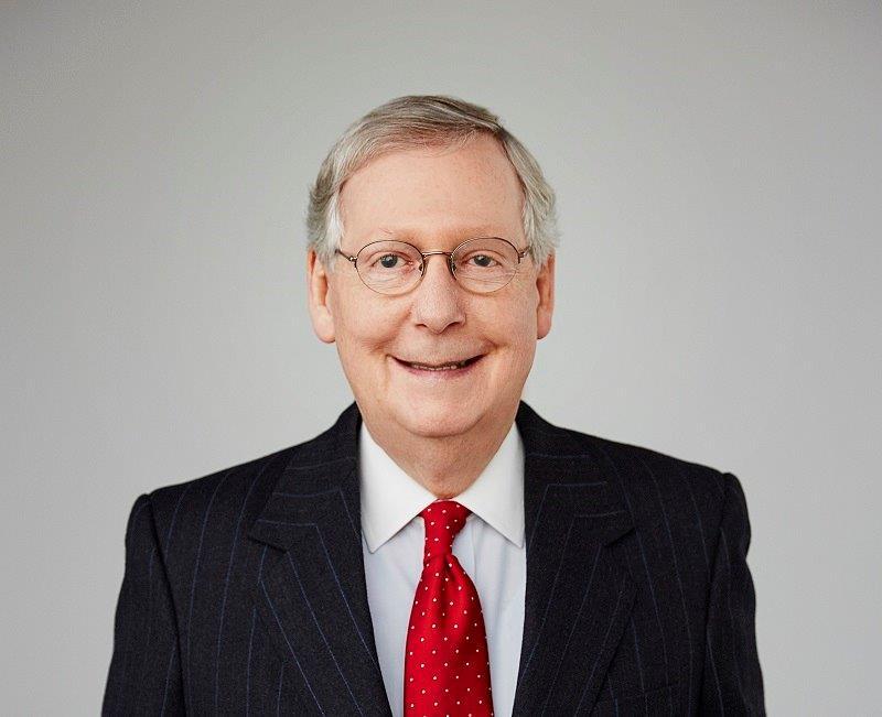 A person in a suit and tie

Description automatically generated