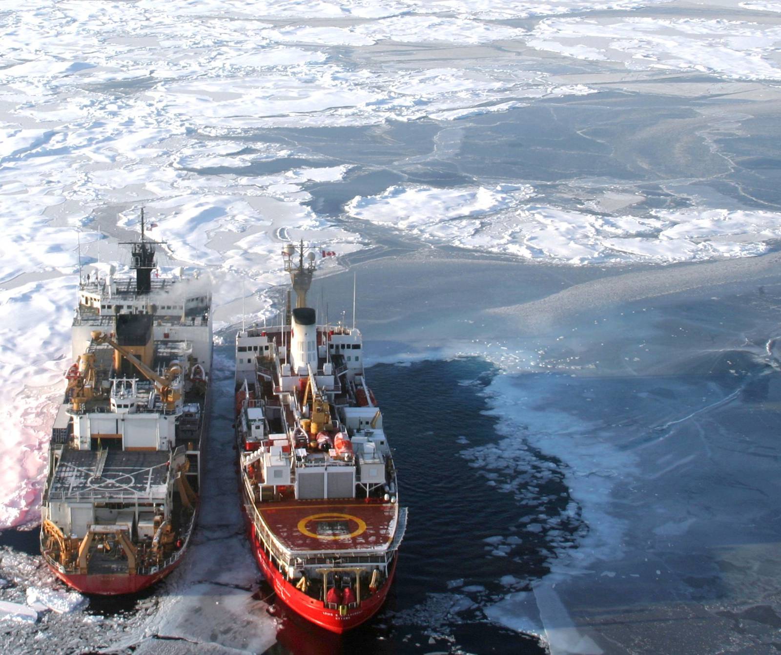 Ships on the ice near the ocean

Description automatically generated with medium confidence