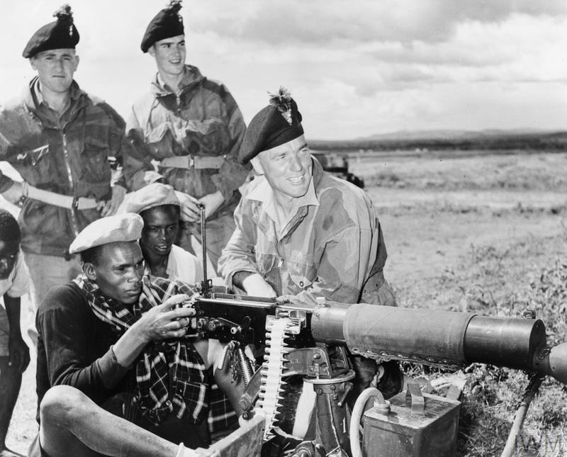A group of men in military uniforms
Description automatically generated