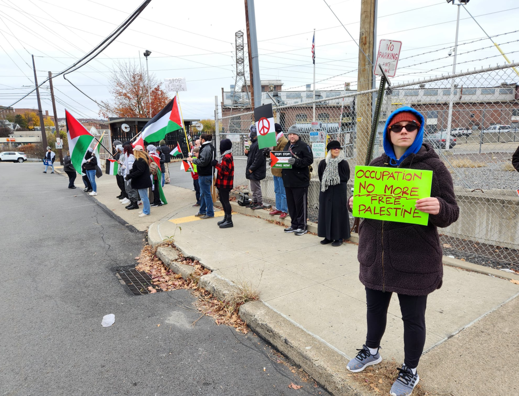 A group of people holding signs Description automatically generated