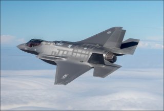 A jet flying in the sky

Description automatically generated