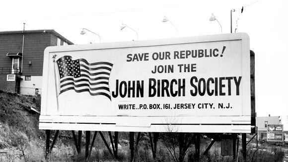 A large billboard with a flag

Description automatically generated