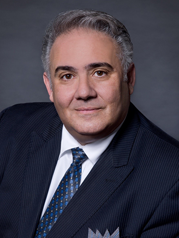 A person in a suit and tie
Description automatically generated