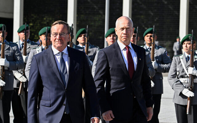 Defense Minister Yoav Gallant (R) and his German counterpart Boris Pistorius inspect an honor guard before signing a declaration of Intent on the Arrow 3 missile defense system, at the German defense ministry in Berlin on September 28, 2023. (Tobias Schwarz/AFP)
