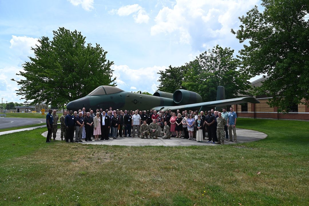 Photo by 174th Attack Wing on June 08, 2024. May be an image of 9 people, blimp, airplane, propeller and text.