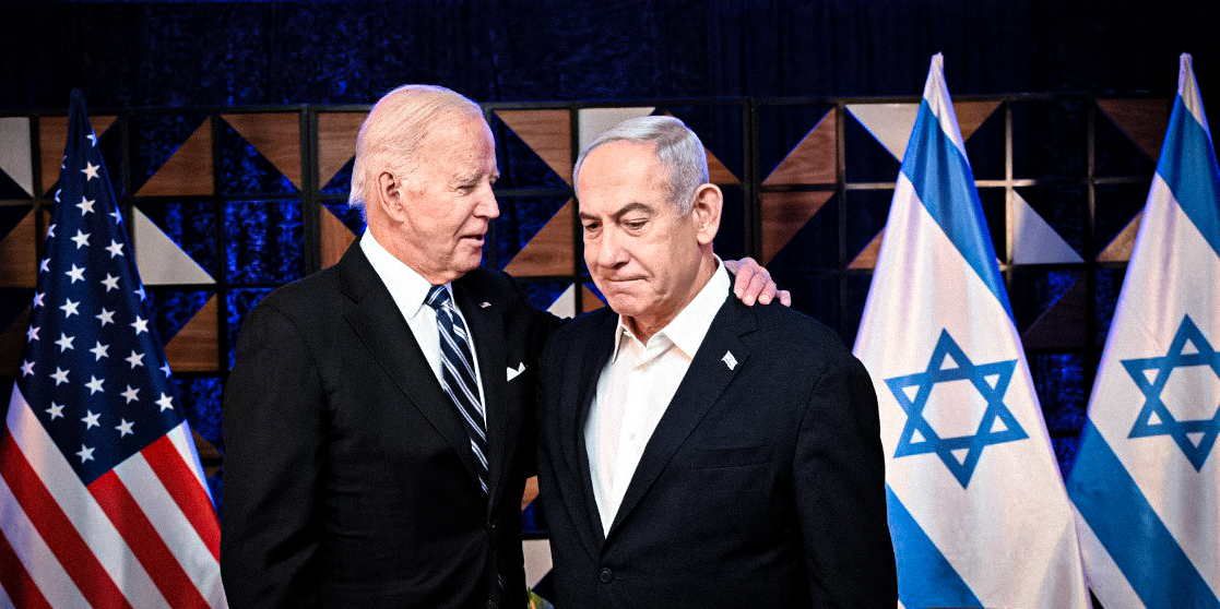 Two men in suits standing next to each other

Description automatically generated