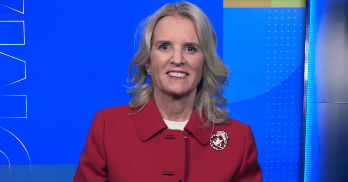 A person in a red coat

Description automatically generated