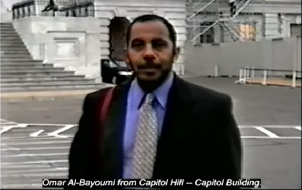 A person in a suit and tie

Description automatically generated