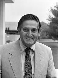 A person in a suit and tie
Description automatically generated
