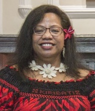 A person smiling at camera

Description automatically generated