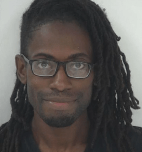 A person with long hair and glasses Description automatically generated with low confidence