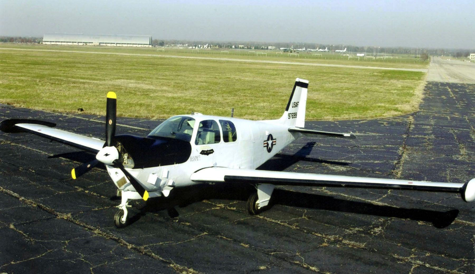 A small airplane on the runway
Description automatically generated