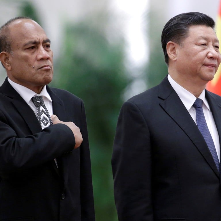 Two men in suits standing next to each other

Description automatically generated