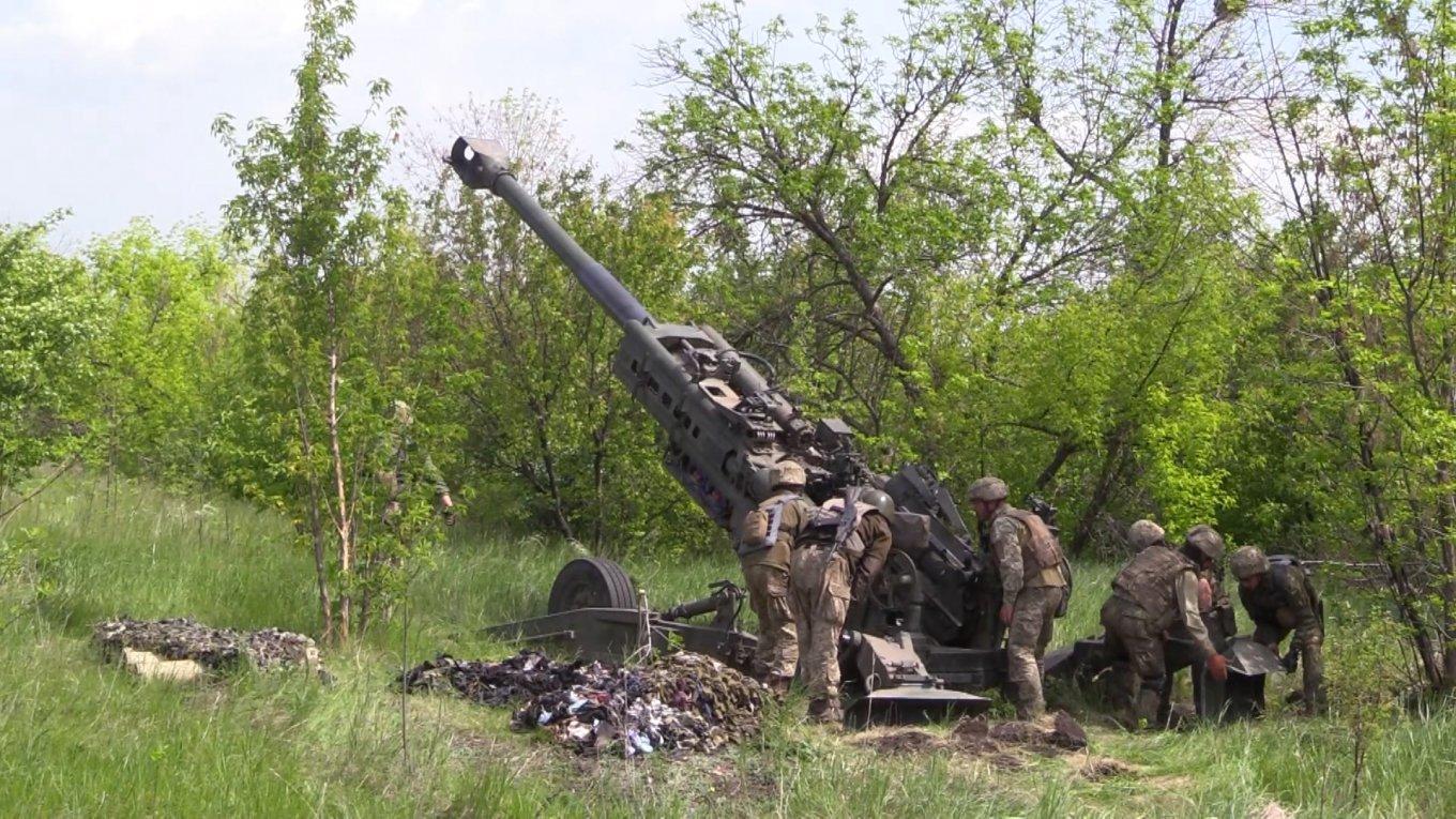 A group of soldiers standing next to a cannon

Description automatically generated