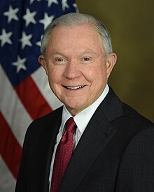 A person in a suit and tie

Description automatically generated
