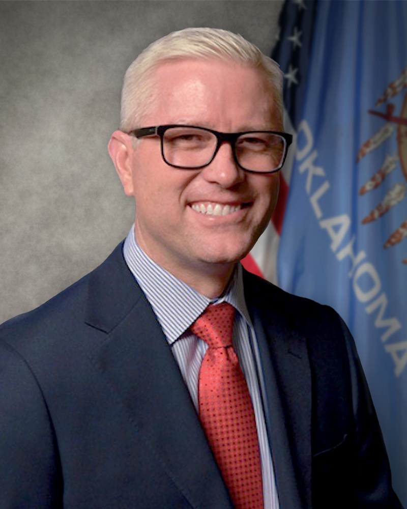 A person in a suit and tie
Description automatically generated