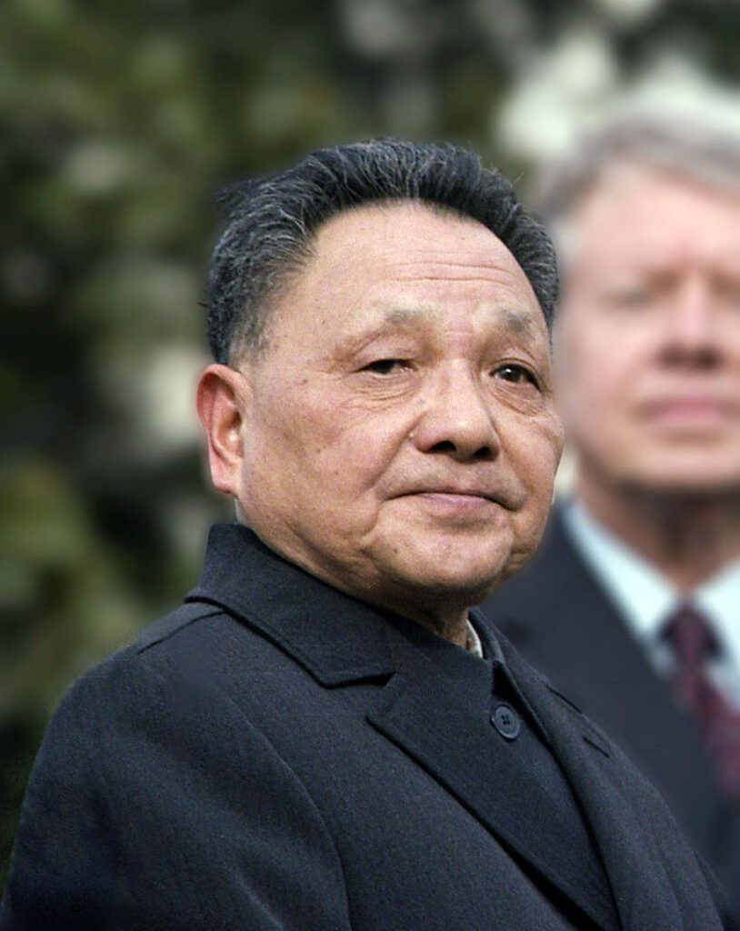 A close-up of a person in a suit

Description automatically generated