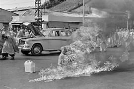 A person burning a car

Description automatically generated