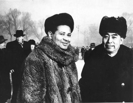 A person in a fur coat and hat

Description automatically generated