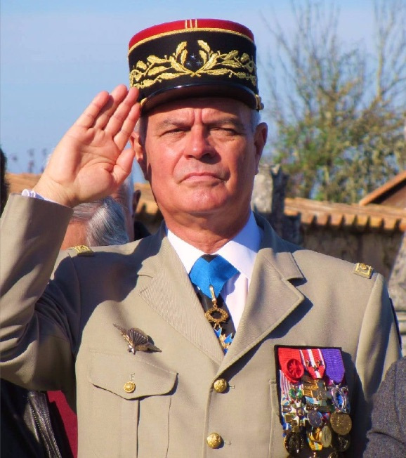 A person in a military uniform saluting

Description automatically generated