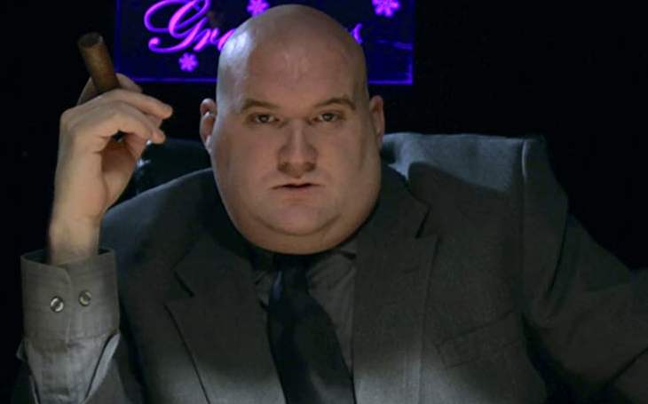 A person in a suit and tie

Description automatically generated