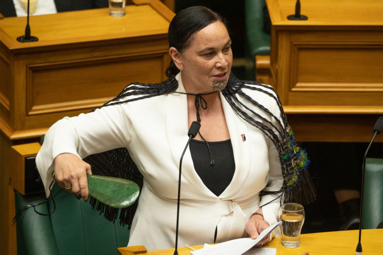 A person in a white jacket

Description automatically generated
