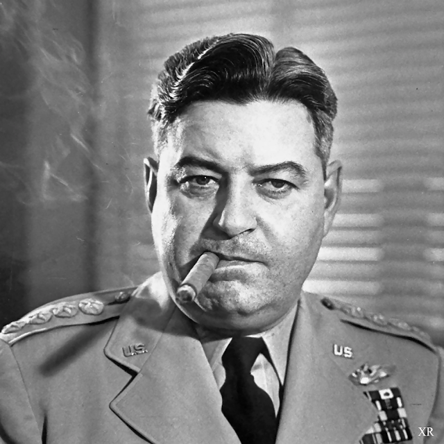 A person in military uniform smoking a cigar

Description automatically generated