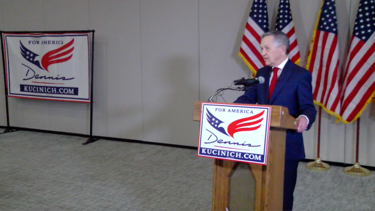A person speaking at a podium
Description automatically generated