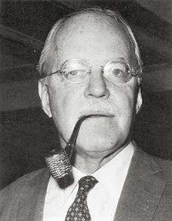 A person with a pipe in his mouth

Description automatically generated