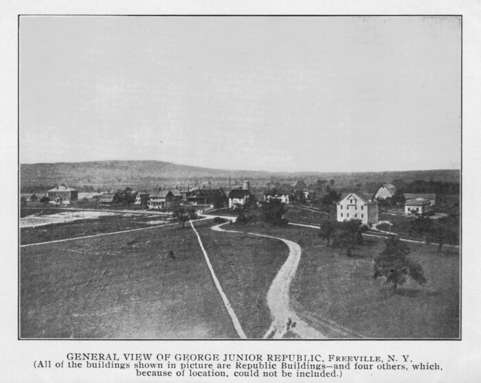 A black and white photo of a town

Description automatically generated