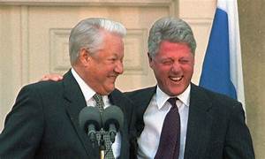 A couple of men in suits

Description automatically generated