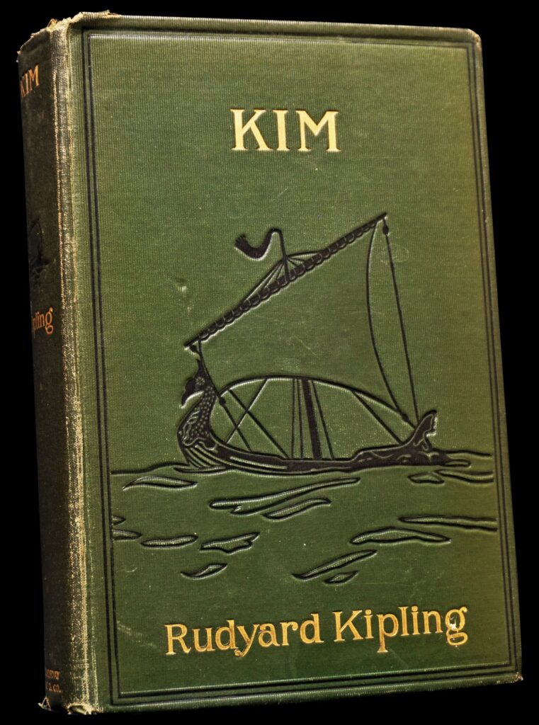 A green book with a picture of a boat on it

Description automatically generated